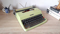 Olivetti Lettera 32 pistachio green vintage typewriter, front three-quarter view