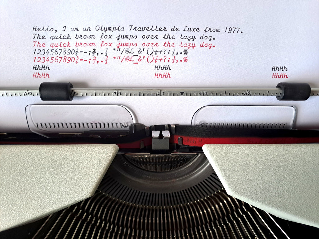 Script (cursive) Olympia Traveller de Luxe Typewriter