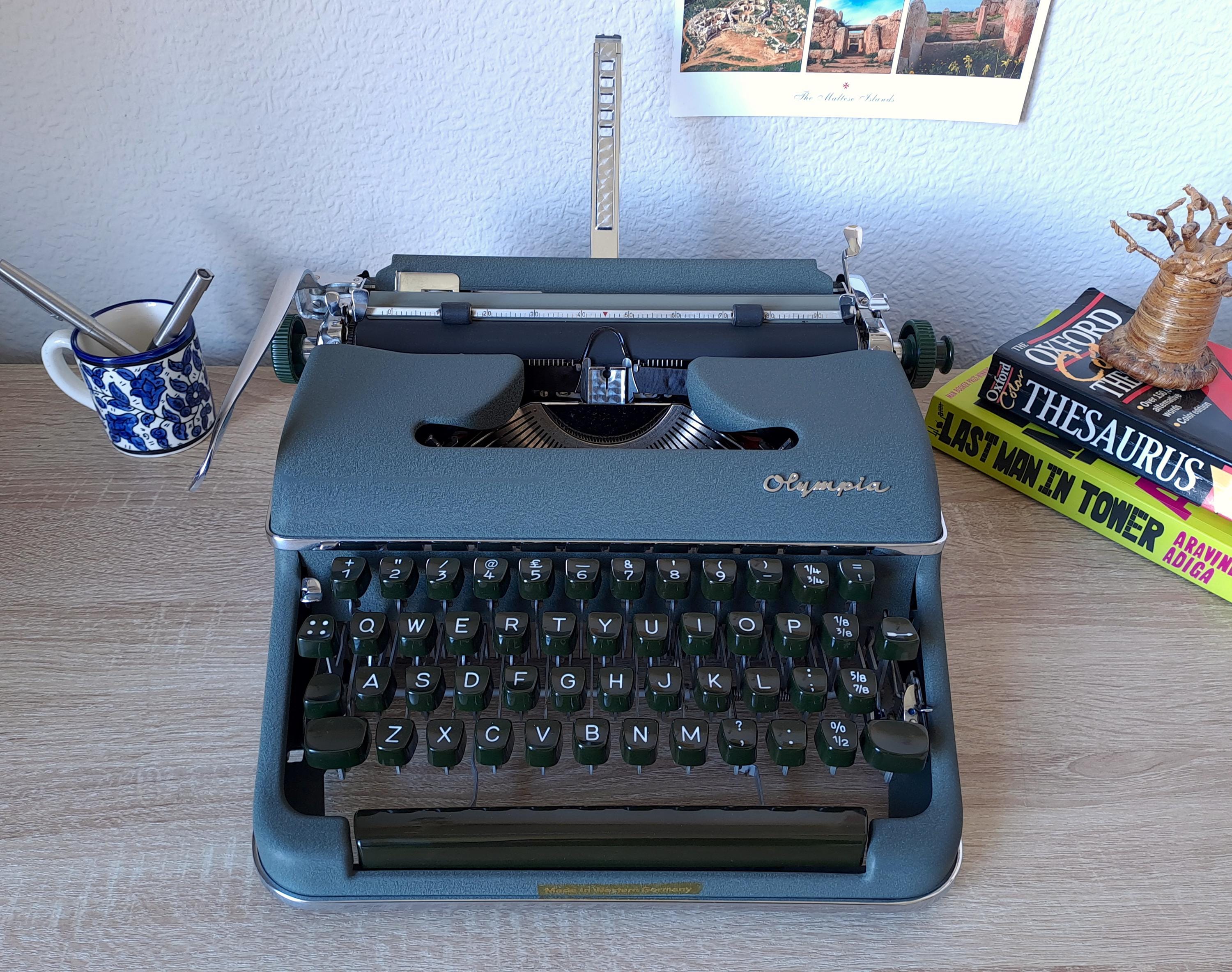 Script (cursive) Olympia SM2 Typewriter